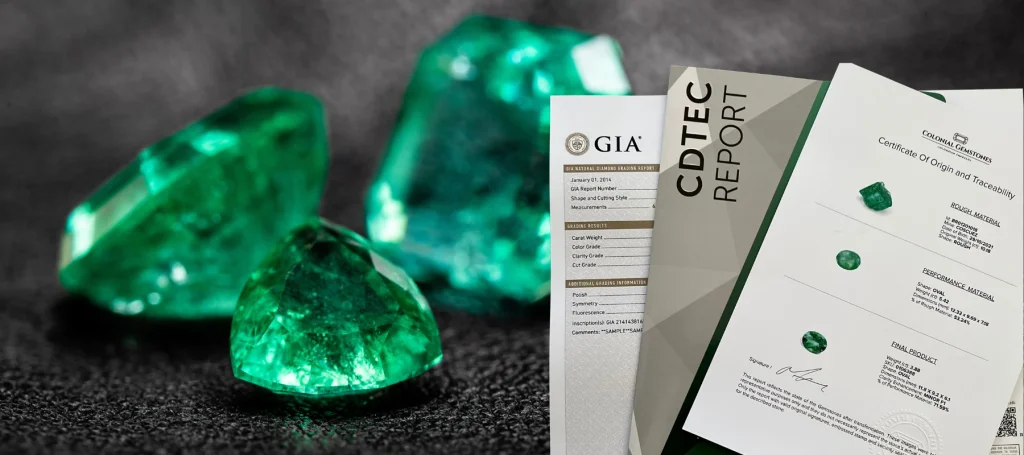 Authentic Colombian emeralds from Muzo, Chivor and Coscuez mines, with a natural emerald against Colombia's mountains